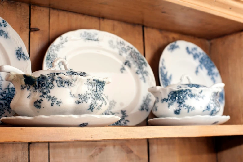 a table with blue and white dishes on it