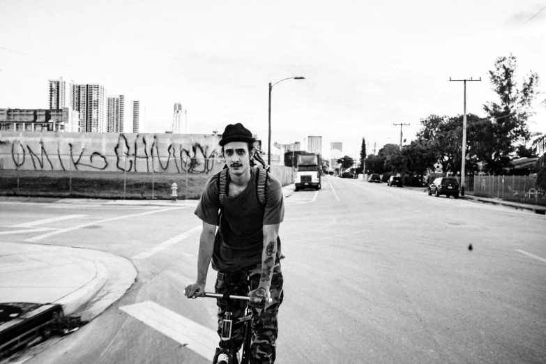 the young man is riding his skateboard in the road