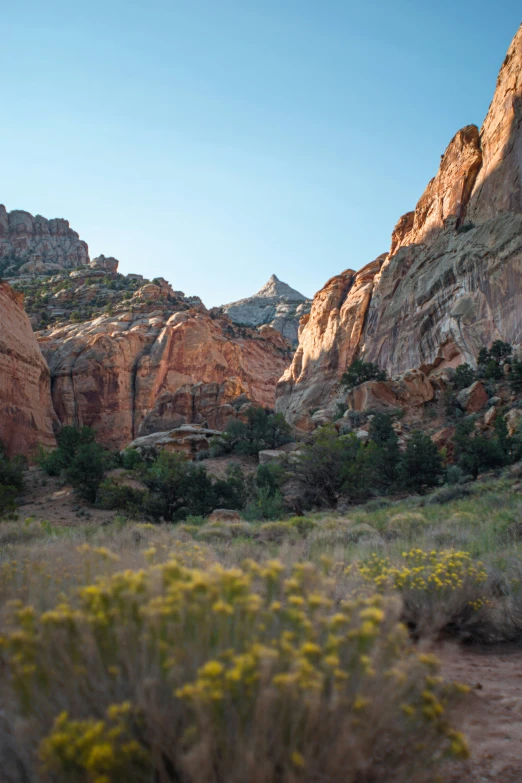 an arid and rocky landscape is illuminated by sun