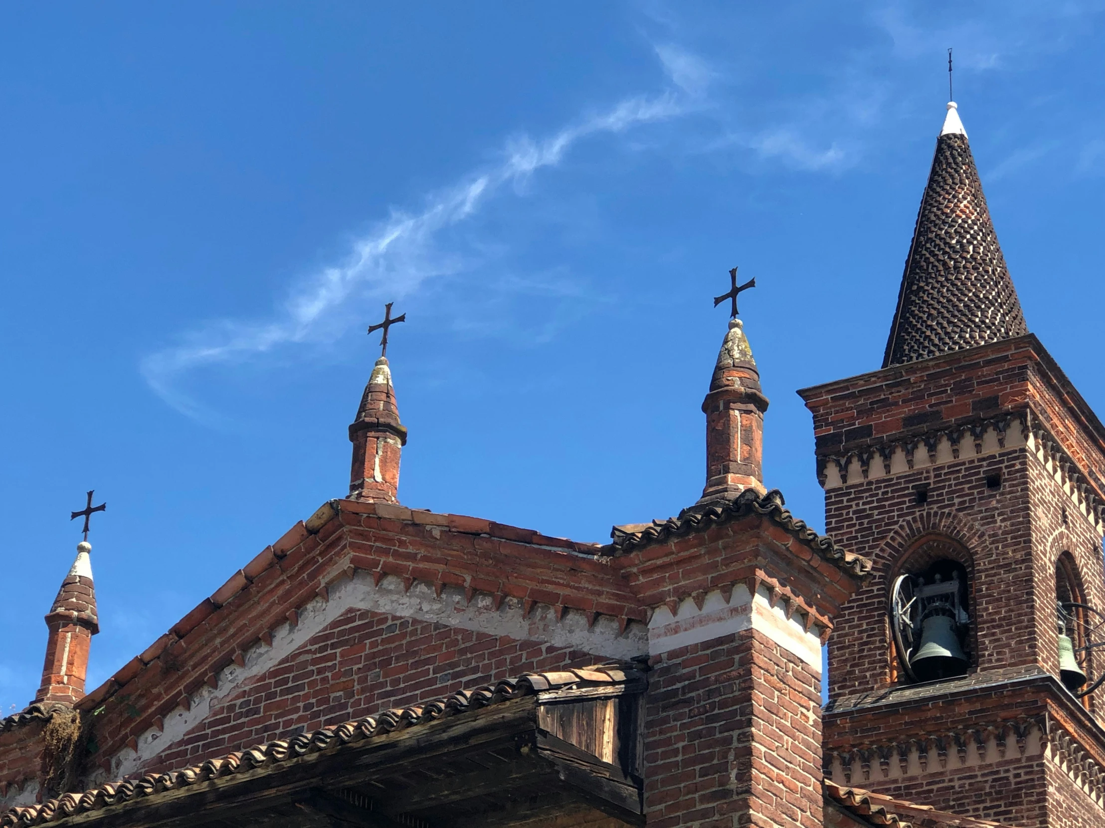 a church with three crosses and a bell tower