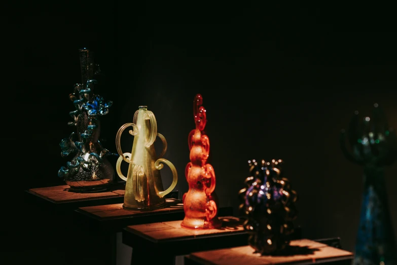 decorative lights sit on a table with glass items