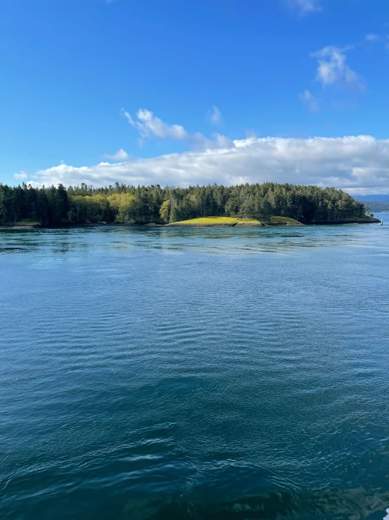 a large body of water that has islands in the background