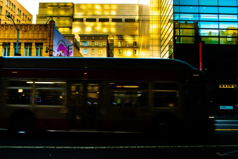 a bus in front of some buildings on the road