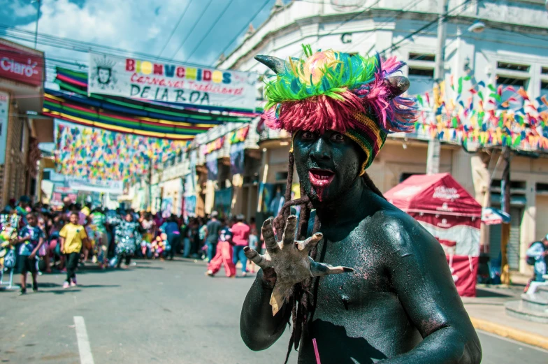 man in black and colored clothing dancing on the street