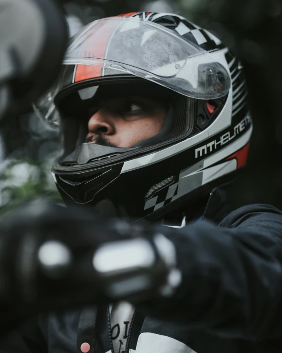 a man with a black helmet and goggles on