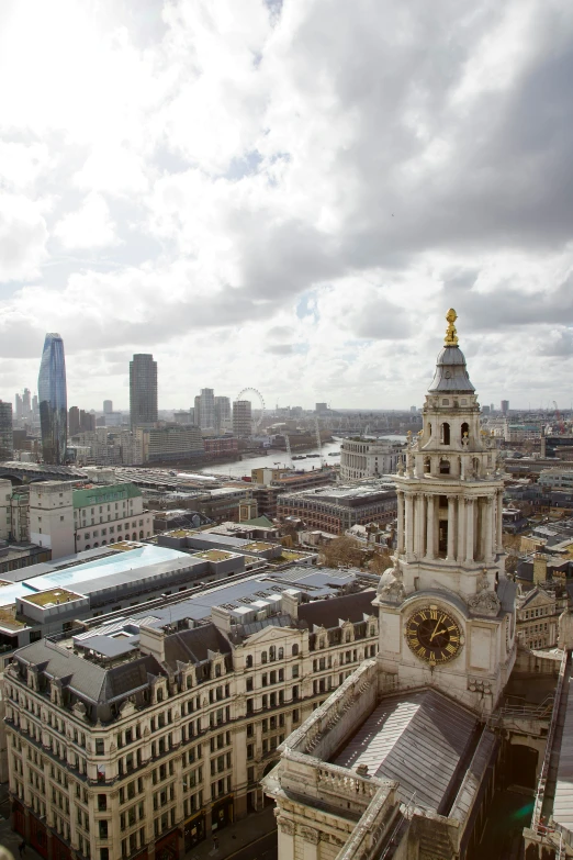 a clock tower in the distance on a cloudy day