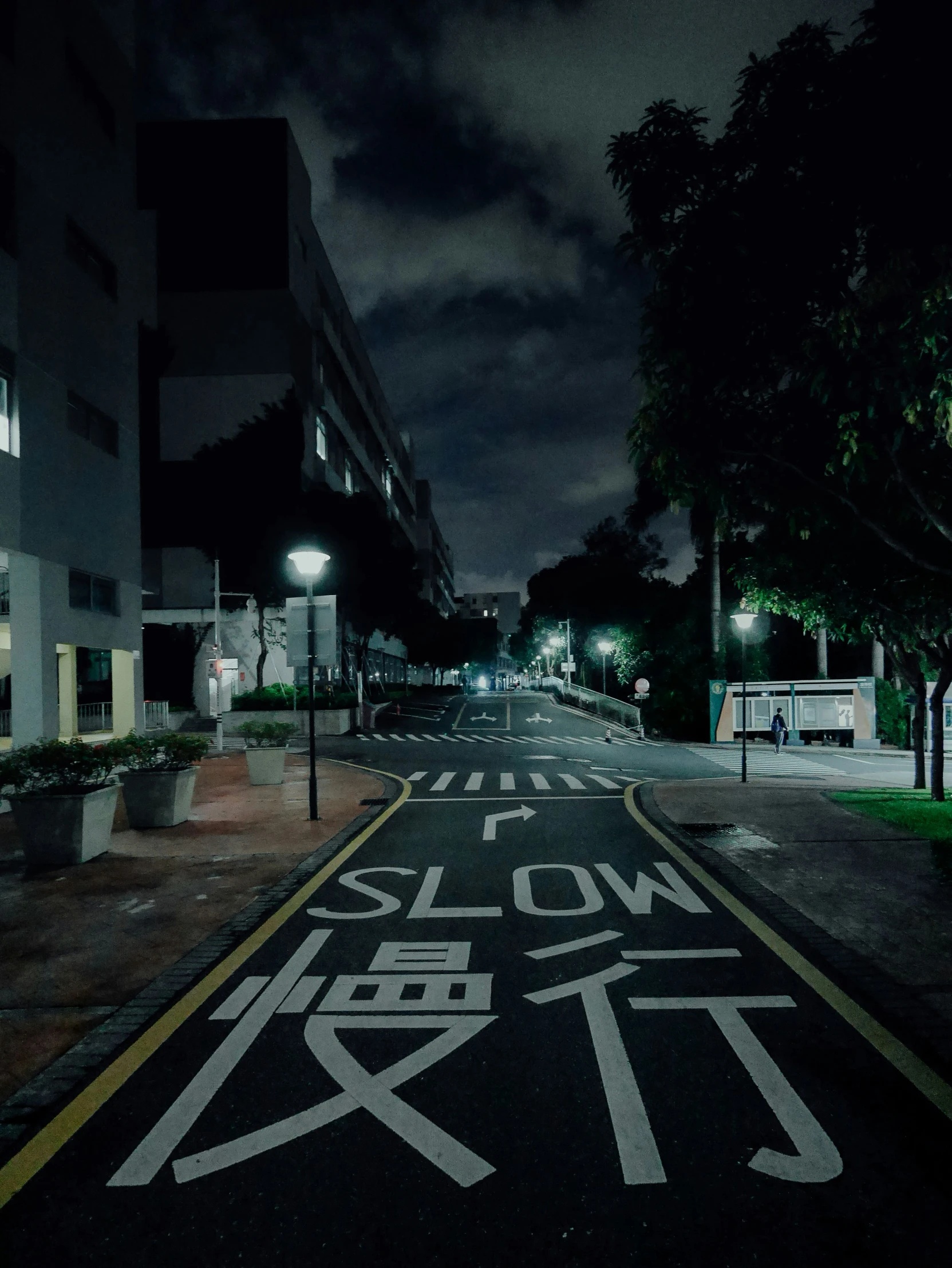 an empty road with a lighted up crosswalk