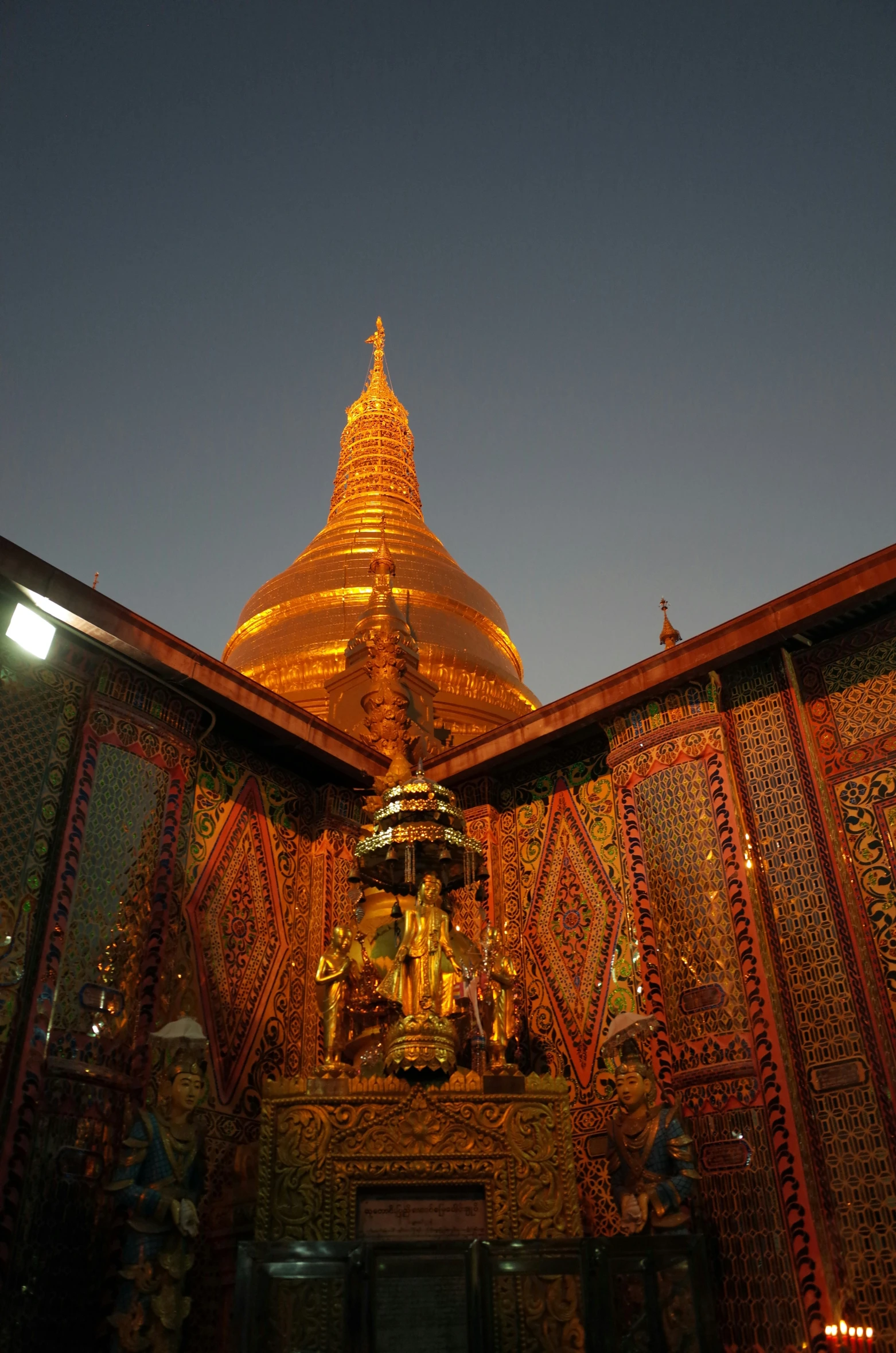 the buddha is on the top of the gold temple