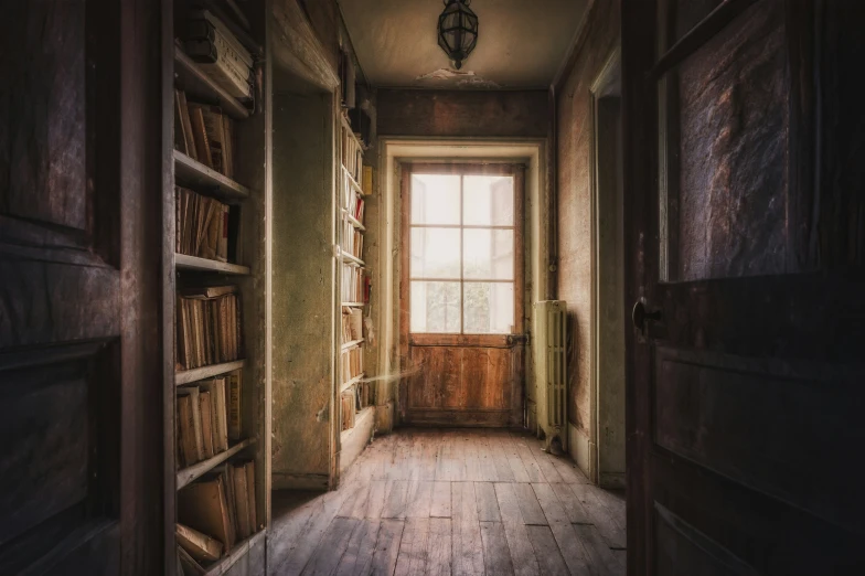 there is a long bookshelf with lots of books on it