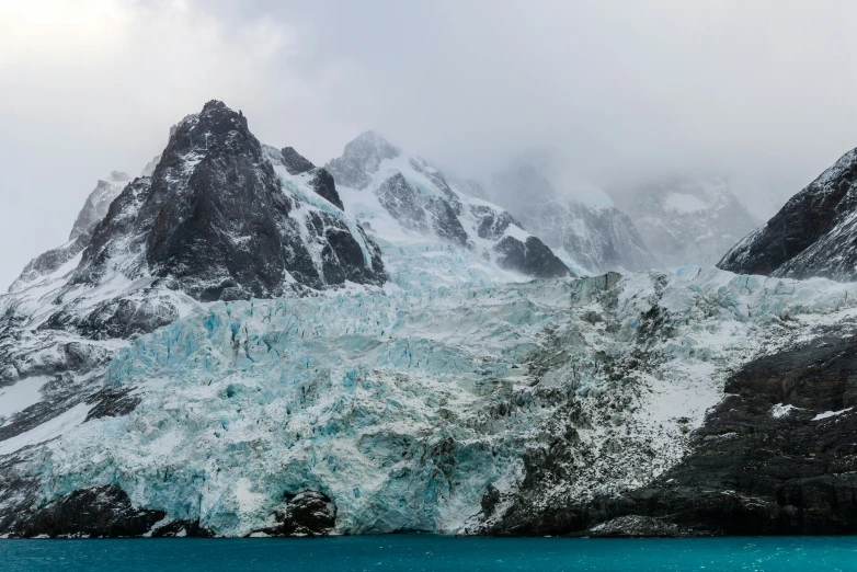 mountains, snow and water in a landscape po