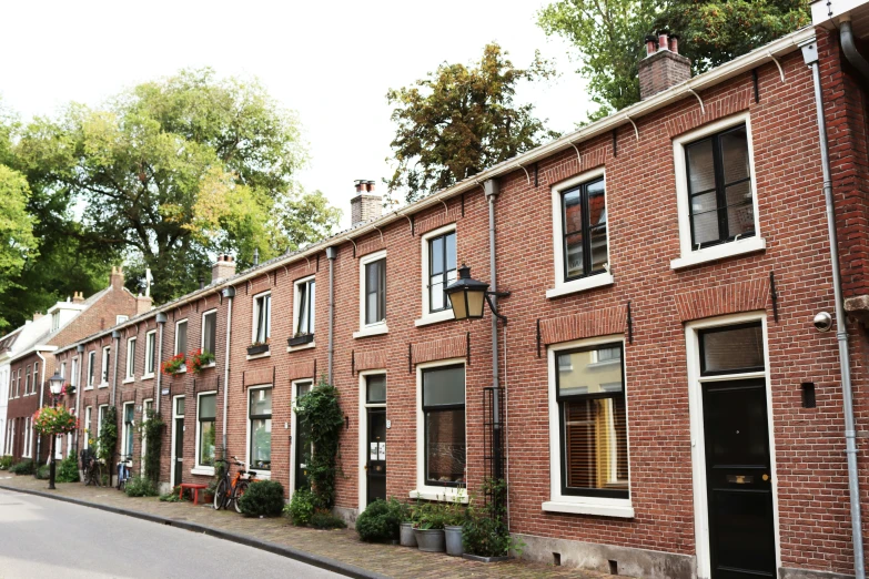 brick town houses in front of a street