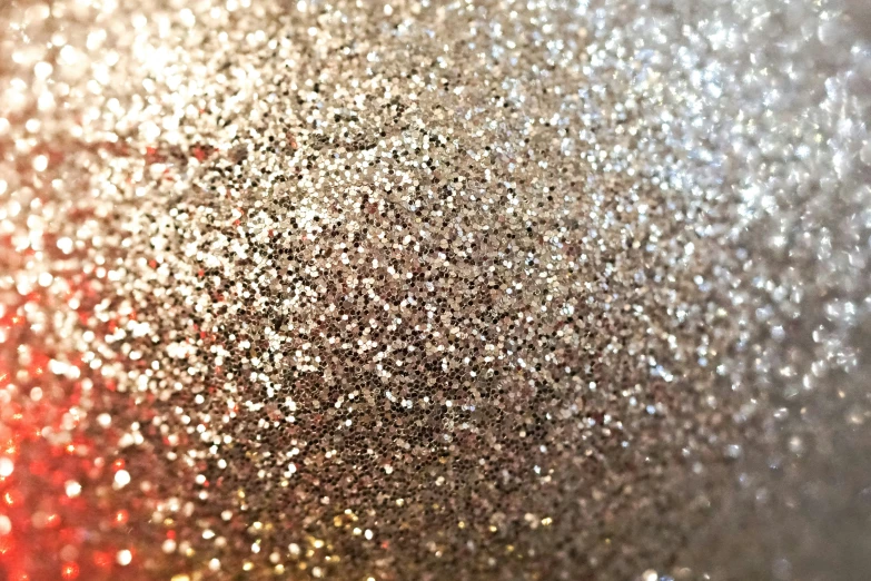 an image of sparkle glitter overlaying a glass surface