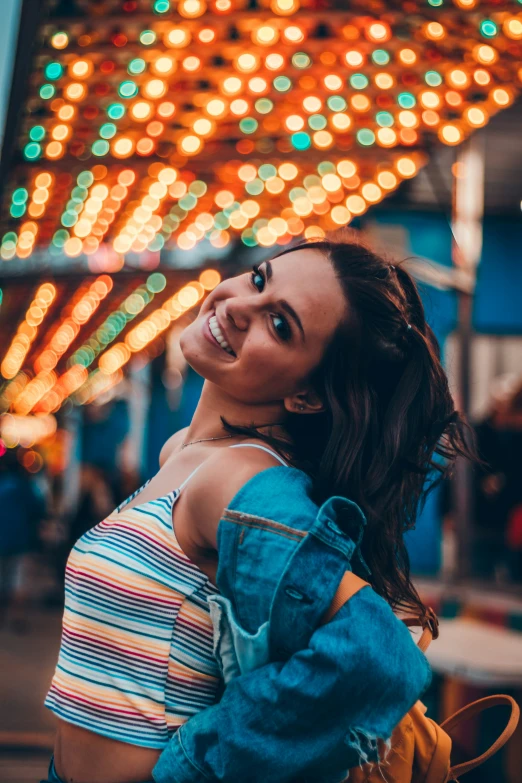 a woman looking straight ahead on an amut park ride