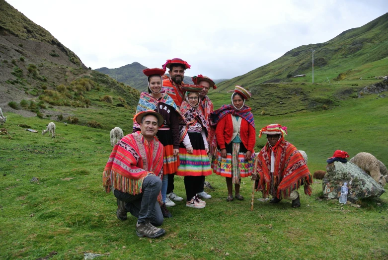 a group of people posing for a picture on a field