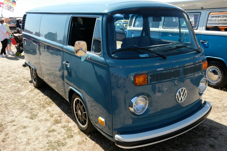 a classic vw bus parked in a field