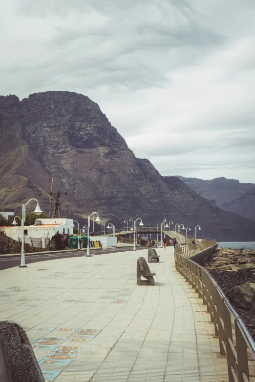 the walkway to the beach has two people on it