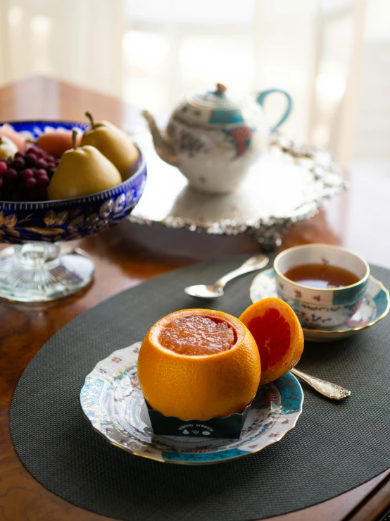 there are various fruits and cups on this table