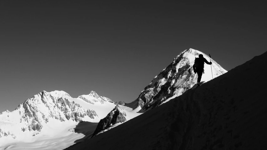 a person riding skis on top of a snowy slope