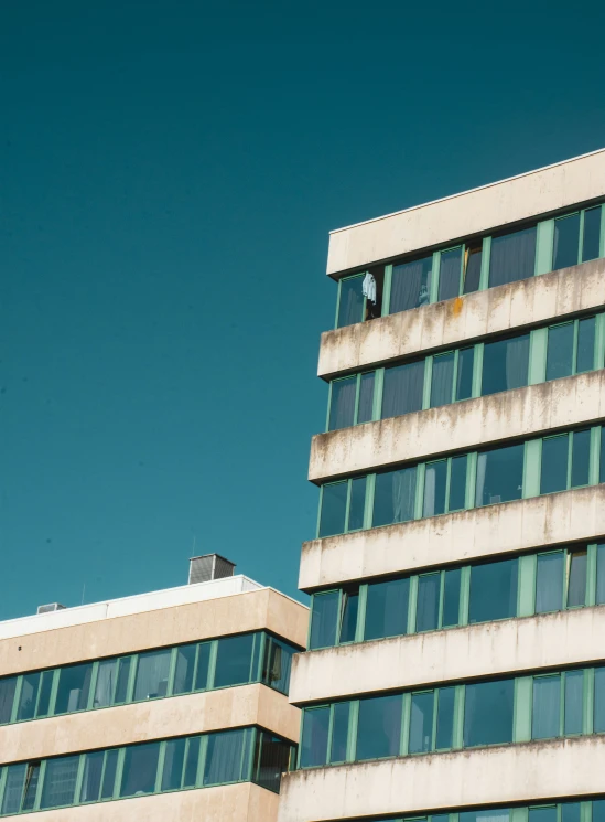 a very tall white building with lots of windows