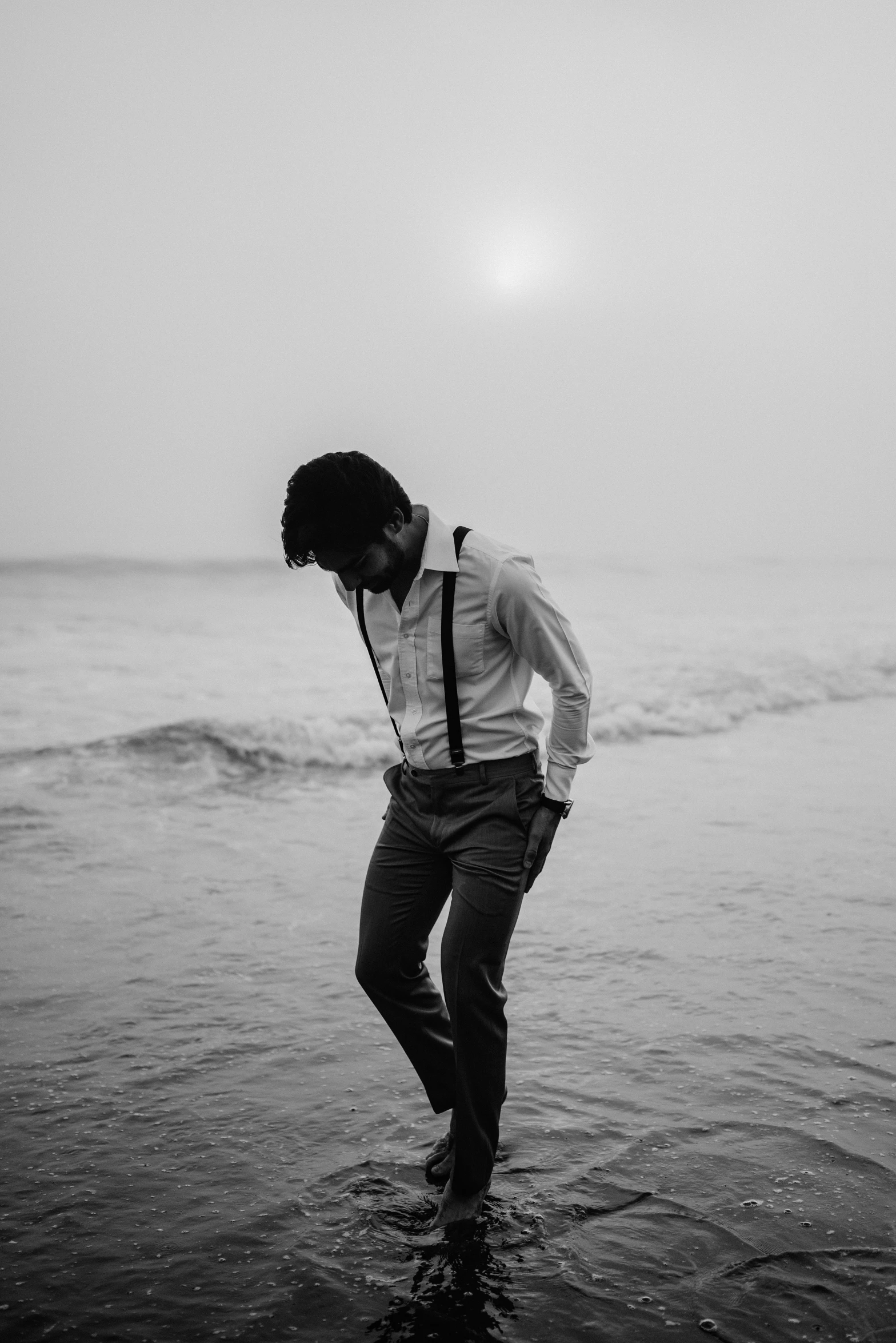 black and white pograph of a man in a shirt and tie