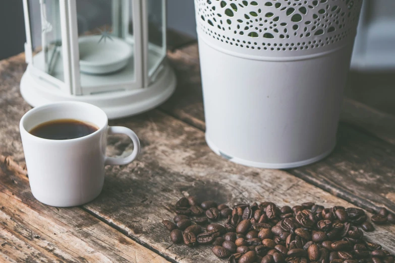 coffee is sitting on a table and beside it are two lamps