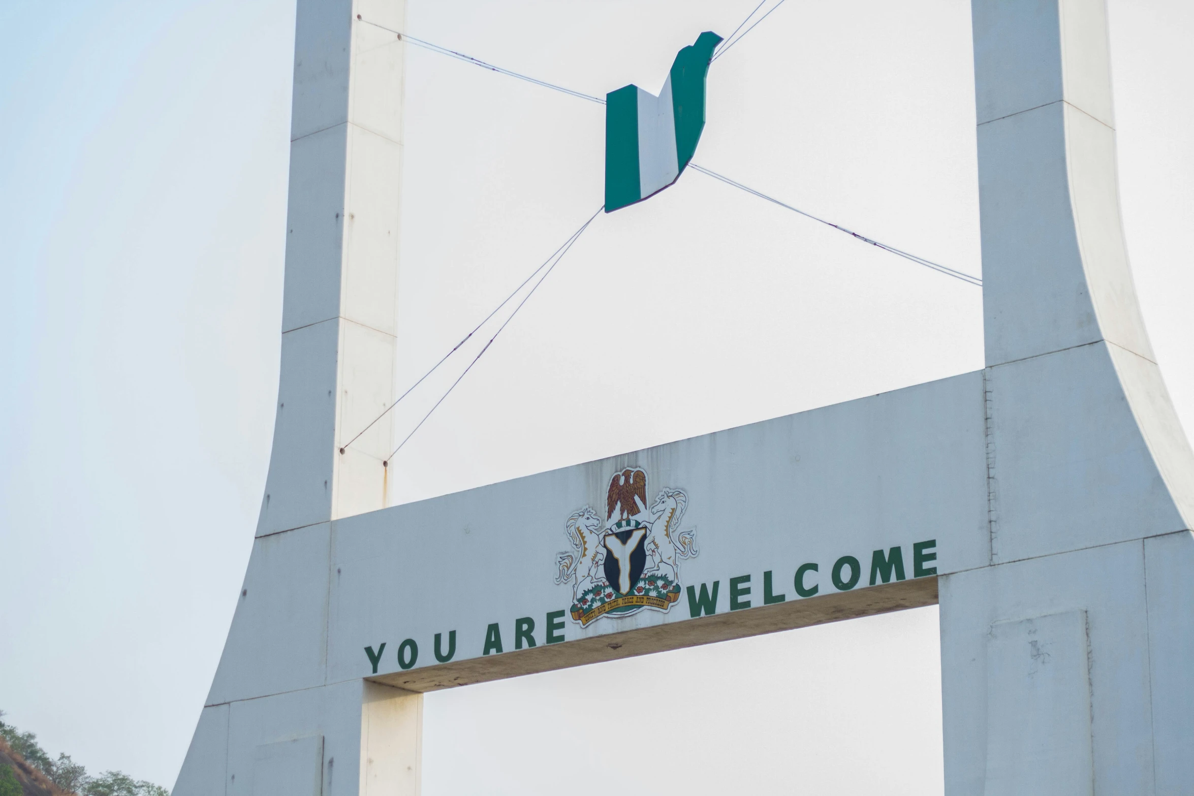 a sign that reads you are welcome at a gate