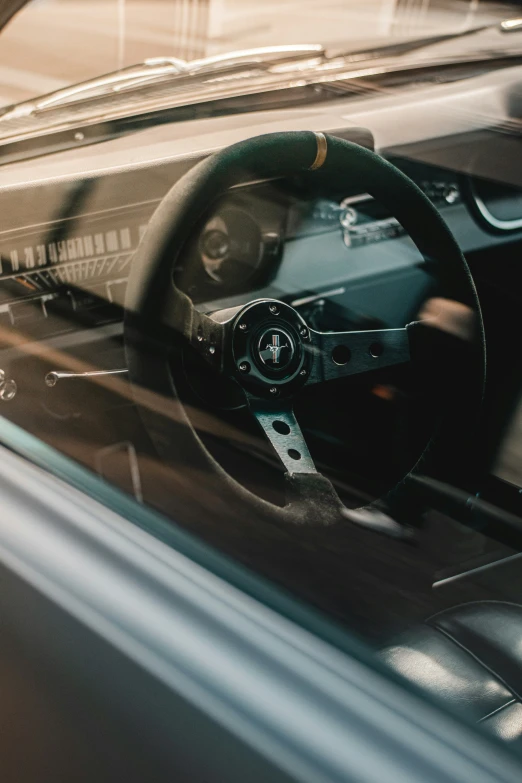 a car dashboard with a steering wheel and dash strip