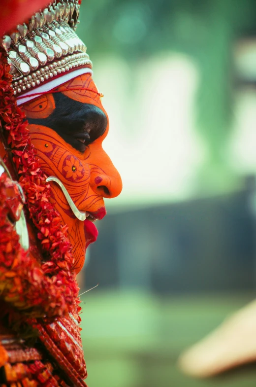 a close up s of a man wearing a red and yellow face paint