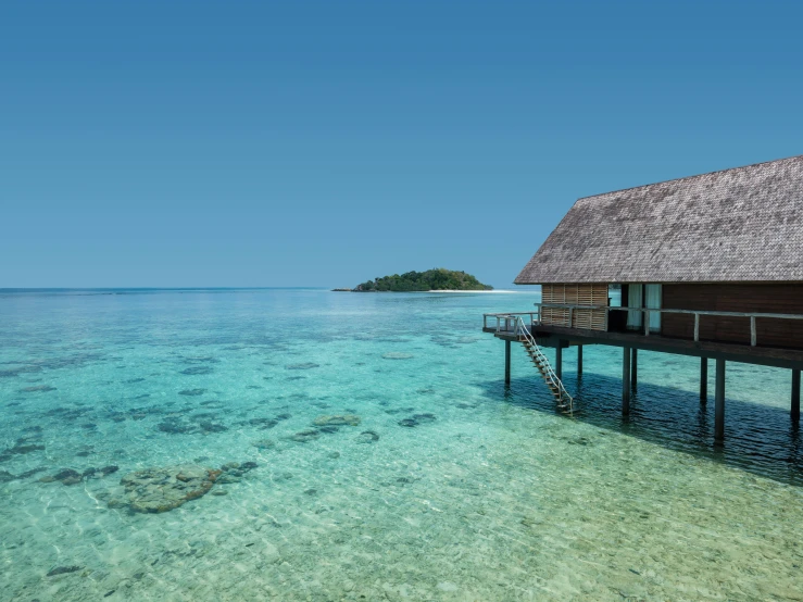 an ocean view with a small shack and water