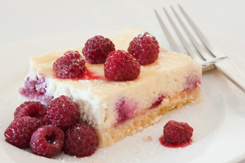 a close up of a plate with some cake