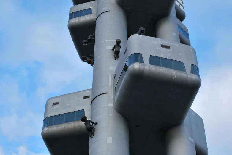 a building made of metal tubes with blue skies behind it