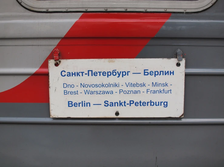 the back side of an older german bus that has been painted in different colors