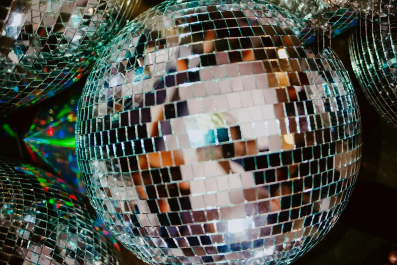 a mirror ball with lights and a reflection on it