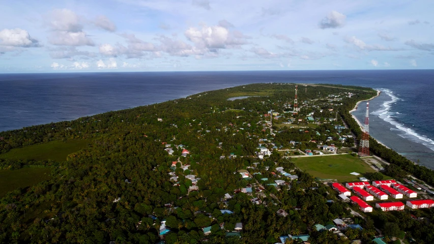 an aerial s of small town and coast near the water