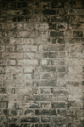 an image of old brick wall with white paint