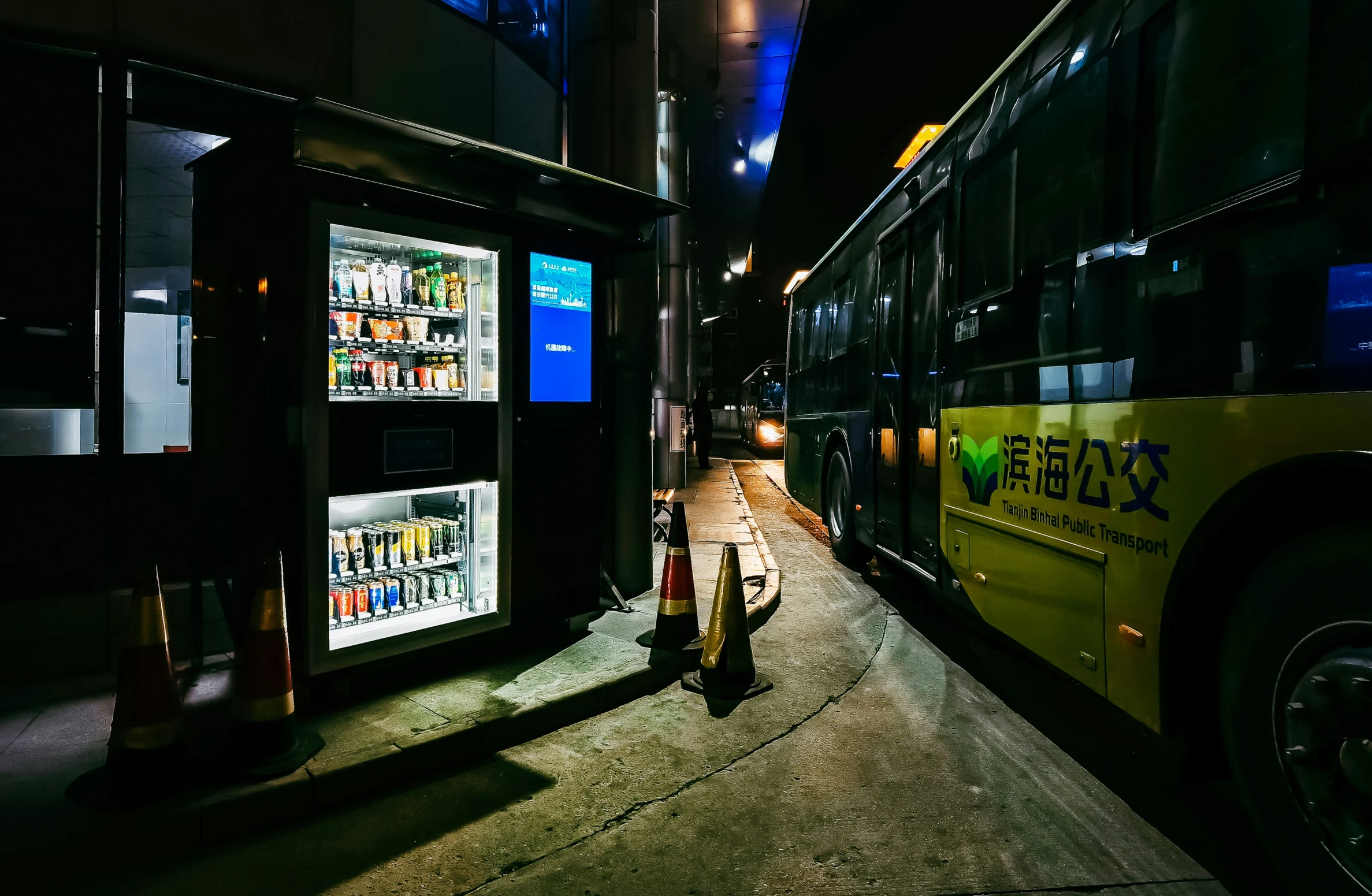 a couple of buses parked next to each other on the street