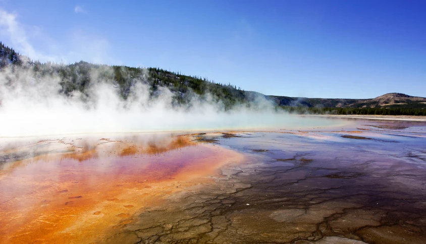 a steam - powered geyser sits on the floor of a crater