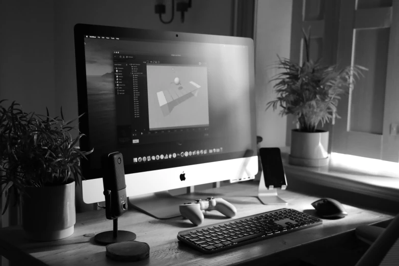 computer sitting on a desk with a laptop and keyboard