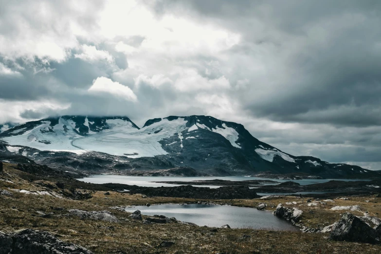 a mountain top with some snow on it