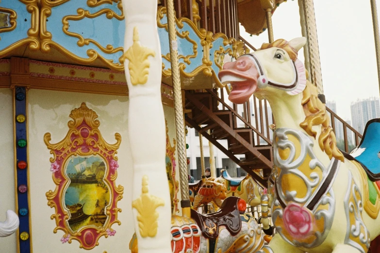 a brightly colored carousel with people on it