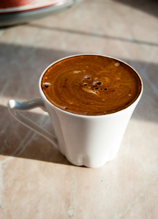 a mug of  chocolate with chocolate flakes