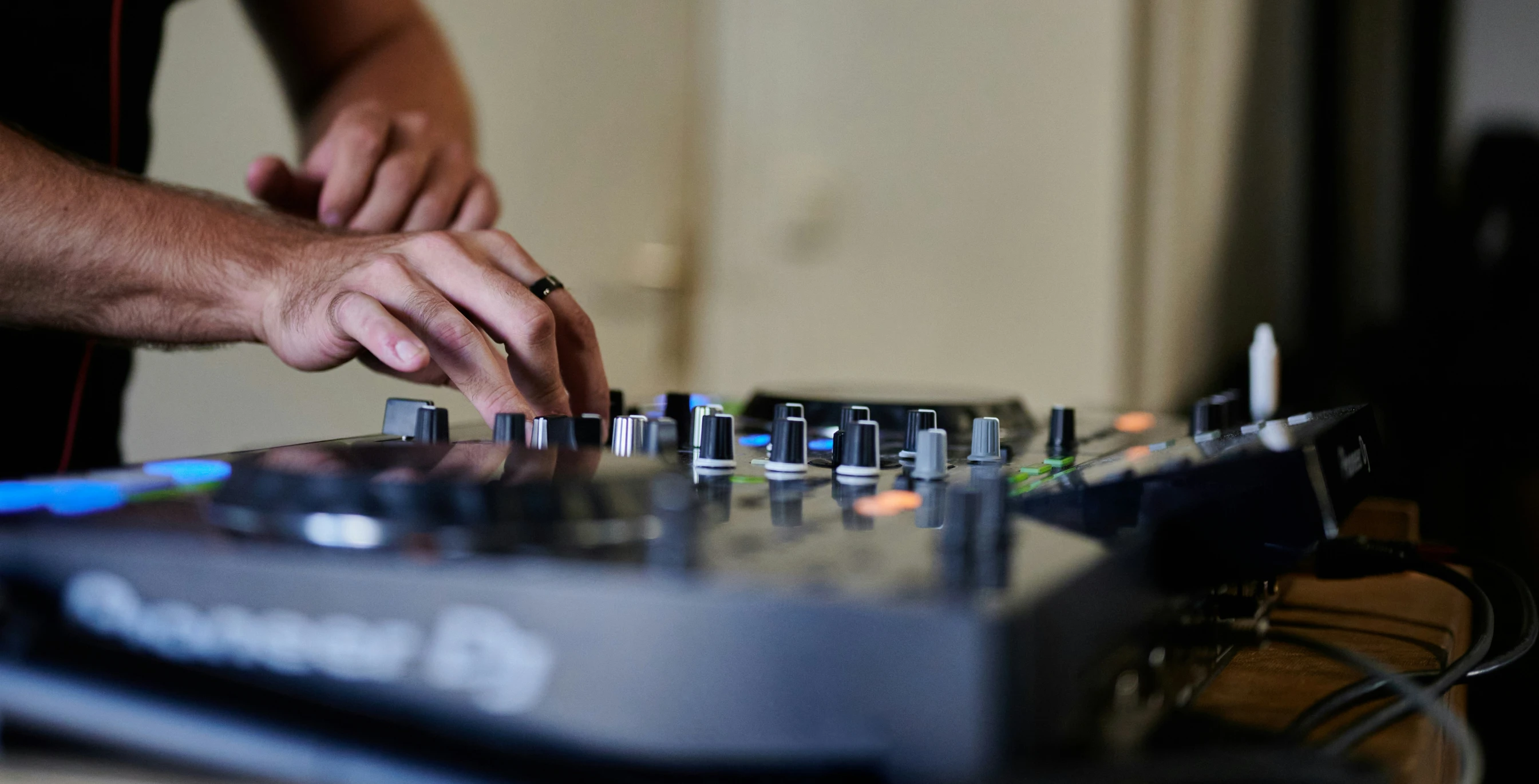 a dj in the process of mixing music