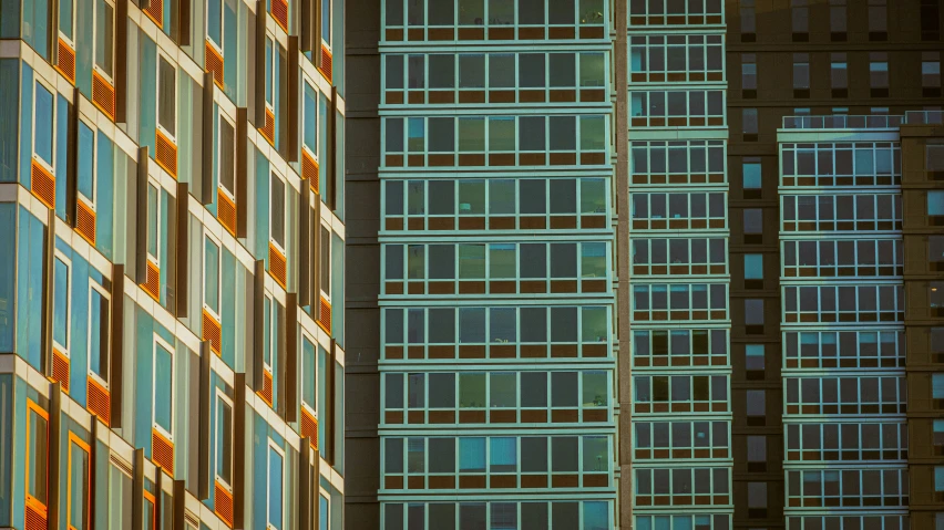 tall buildings with multiple windows at night