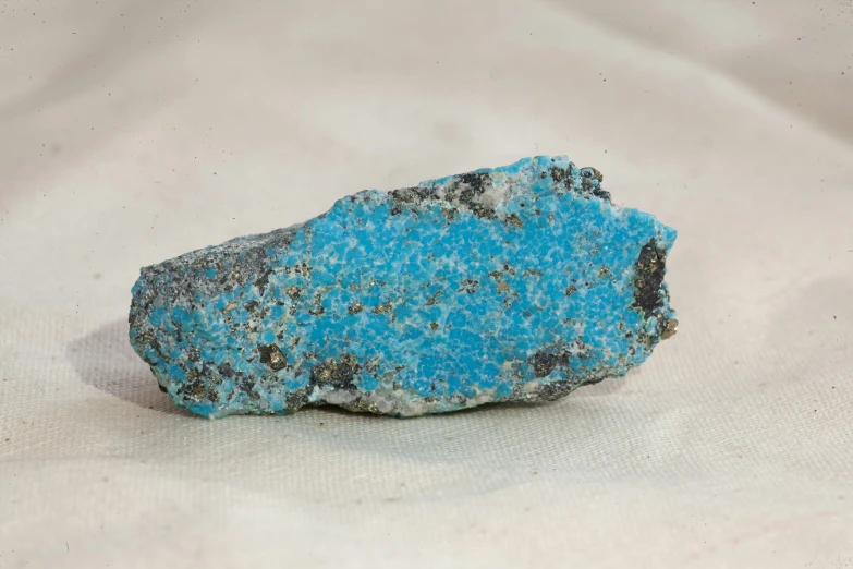 a single blue stone rock with ligni, smokiered and spots