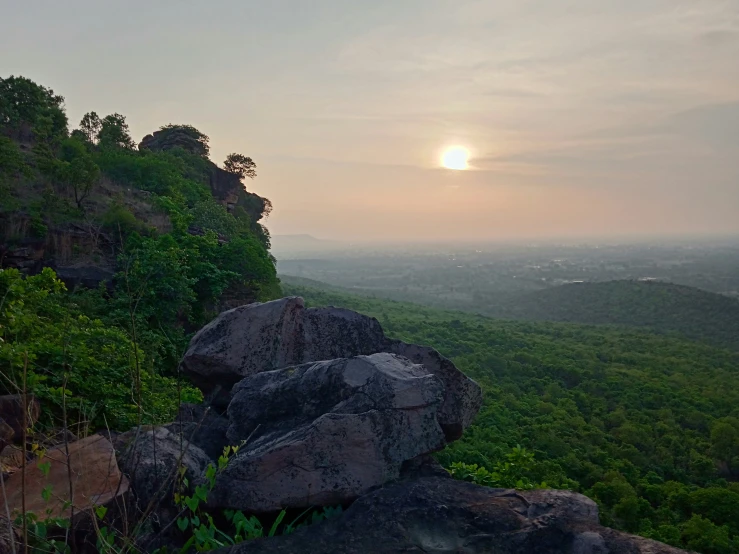 a very tall rock sitting on top of a hill