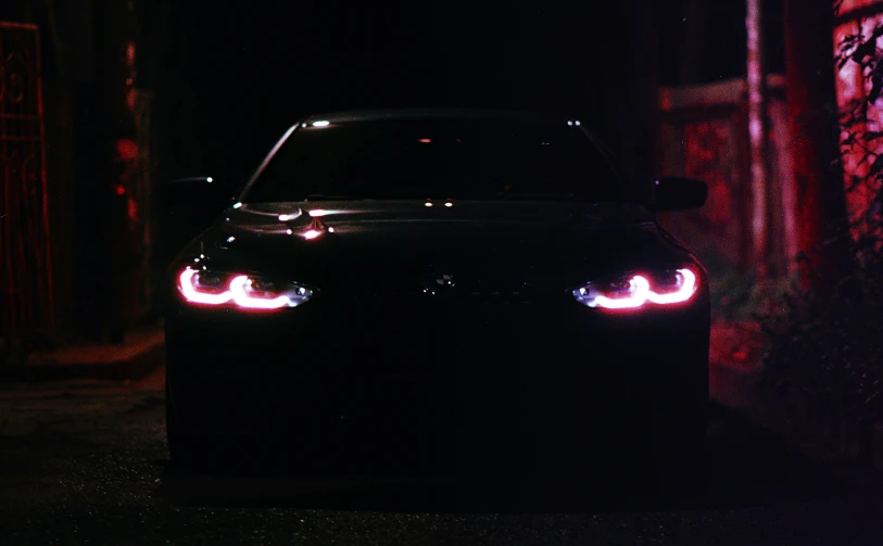a car with the lights turned on at night