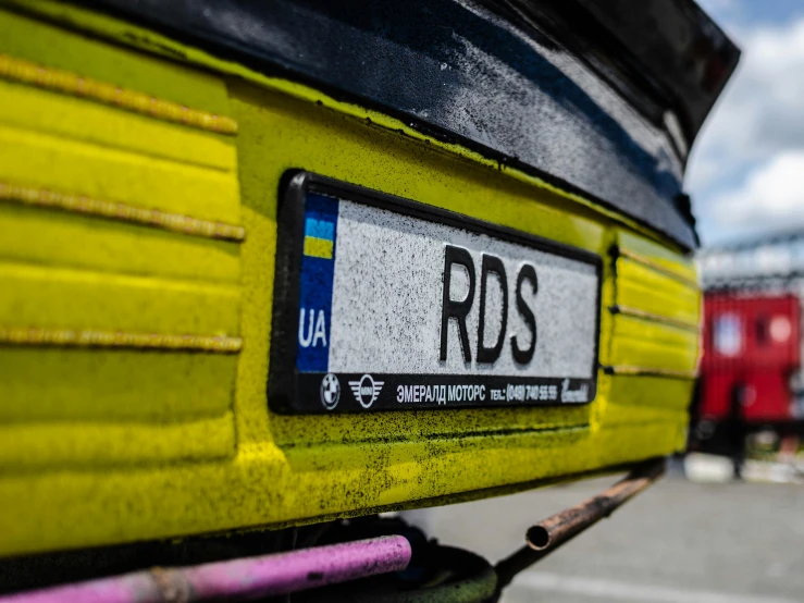 a yellow bus parked on the side of a road