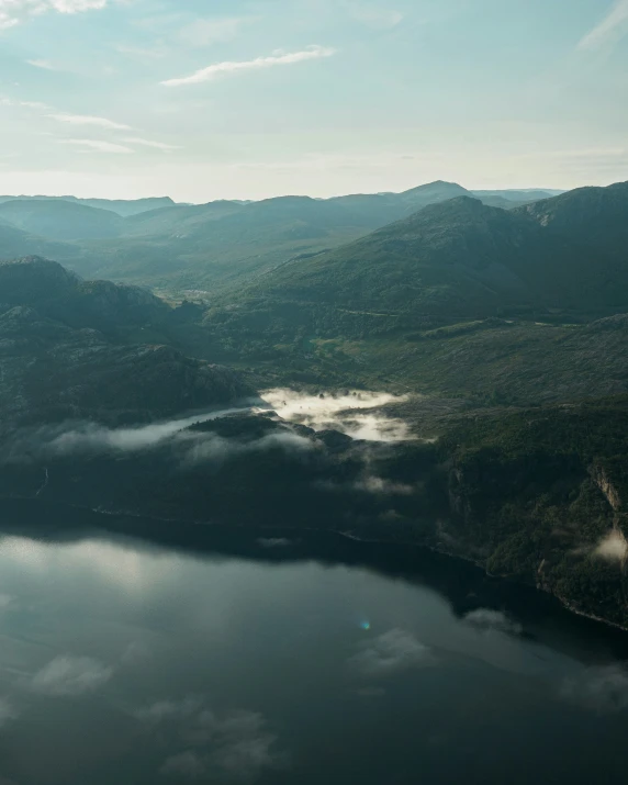 aerial view of the mountains and lake below