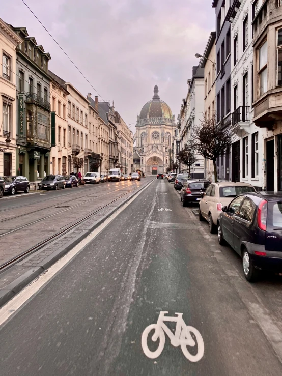 a view of a street with cars and a bike lane