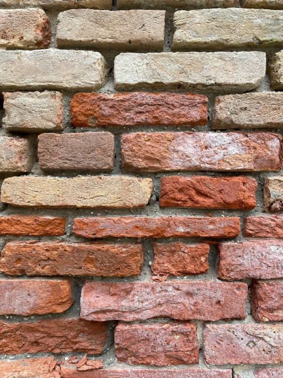 the wall is made from red bricks